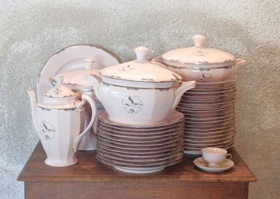 a stack of dishes and cups sitting on a table