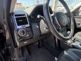 a view of the inside of a car from the driver ' s seat