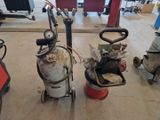 three fire extinguisors sitting on the floor next to each other