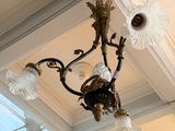 a chandelier hanging from the ceiling in a room