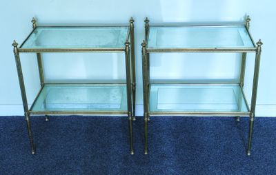 pair of brass and glass side tables with glass shelves