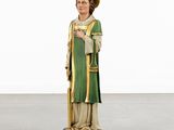 statue of a man in a green robe and hat holding a cane