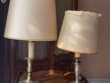 two lamps that are sitting on a table in a room