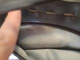 a hand that is holding a purse that is open