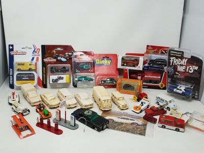 a lot of toy cars and other toys on a table