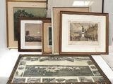 many framed pictures on a table with pictures on it