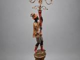 an image of a lamp with a man holding a lamp on it