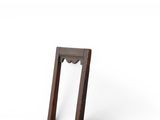 a small wooden chair with a mirror on the back of it