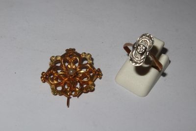 two rings and a ring holder on a white surface