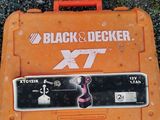 an orange tool box sitting on the ground with a black and decker logo on it