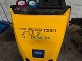 a yellow machine that is sitting in the garage