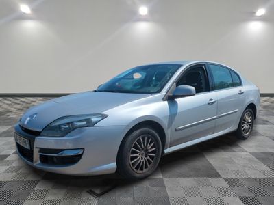 a picture of a silver car that is parked in a garage