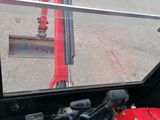 a view of a man in a red suit from inside of a vehicle