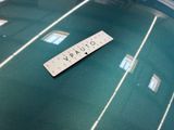 a scrabble on a table with a name on it