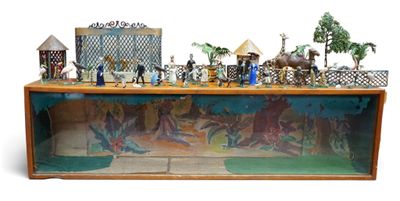 toy figurines of people and animals in a display case