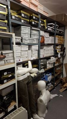 a room filled with lots of boxes and boxes on the shelves