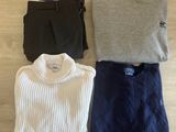three pieces of clothing laid out on a wooden floor