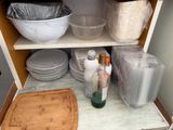 a cabinet with a lot of dishes and bowls on it