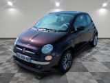 a picture of a small black car parked on a checkered floor