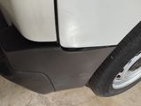 a close up of a tire on a white car