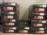 several boxes of shoes are stacked on top of each other in a store