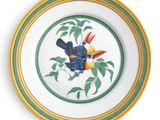 a plate with a bird painted on it on a white background