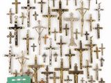 an image of a bunch of crosses that are on a wall