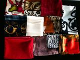 many different types of cloths laid out on a table