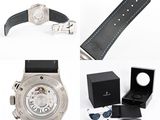 a watch that is sitting next to a watch box