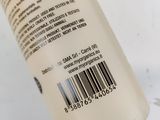 an image of a bottle of body lotion on a white surface
