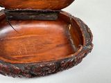 a small wooden box with a lid on a table