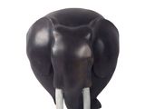 a black elephant head with tusks on a white background