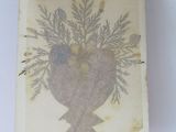 an old picture of a vase with flowers in it