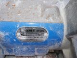 a close up of a blue and white machine on a table
