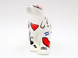ceramic figurine of a white cat with red hearts on it