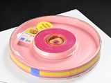 a pink object on a white plate on a table