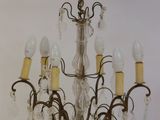 a chandelier that has five lights attached to it