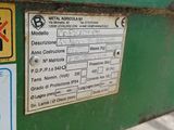 a sign on the side of a green machine