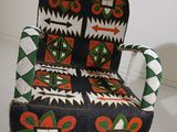 a chair made out of a piece of cloth on display