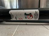 a sticker on the back of a bike on the floor