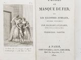 an old book with a picture of a man and a woman