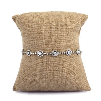 a close up of a pillow on a pillow with a pillow in the background