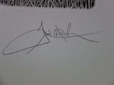 the signature of a man is shown on a piece of paper