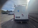 a white van that is parked in a parking lot