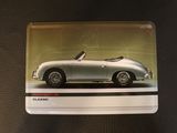 a card with a picture of a silver car on it