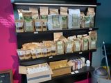 many bags of food on the shelves in the store