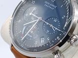 a close up of a watch with a brown leather strap