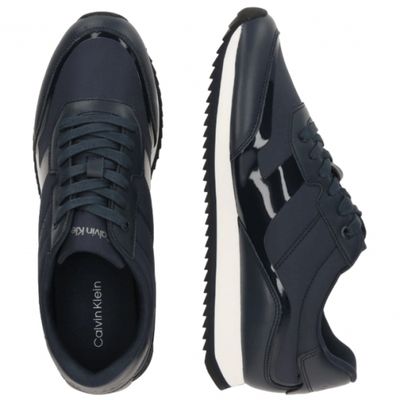 a close up of a pair of black sneakers on a white background