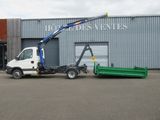 a white truck with a crane attached to the back of it