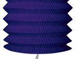 a purple paper lantern hanging from a white string